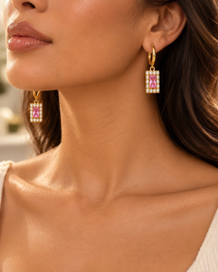 Elli Jewellery gold plated huggie hoop earrings featuring rectangular pink cubic zirconia stones with halo settings