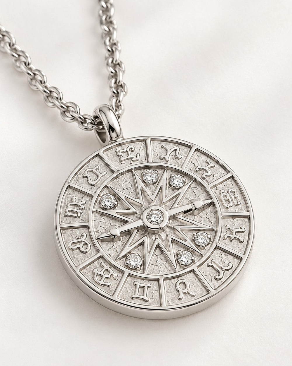 Elli Jewellery rhodium plated compass coin pendant necklace with crystal accents on a silver chain