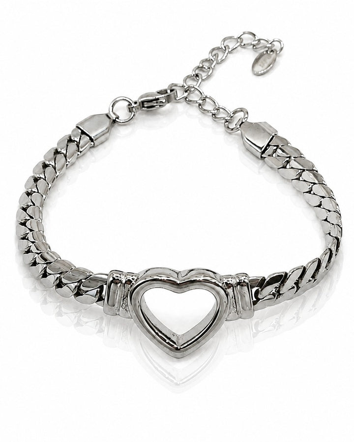 Elli Jewellery rhodium plated Cuban link bracelet featuring a central open heart charm on a white background