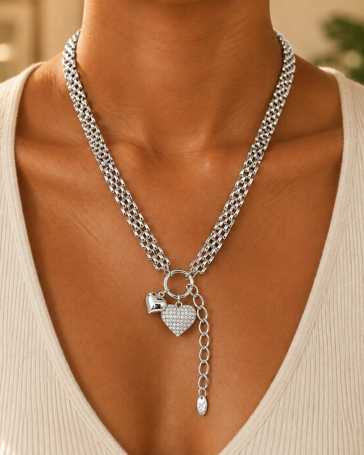 Elli Jewellery rhodium plated layered chain necklace featuring a sparkling heart pendant on a woman
