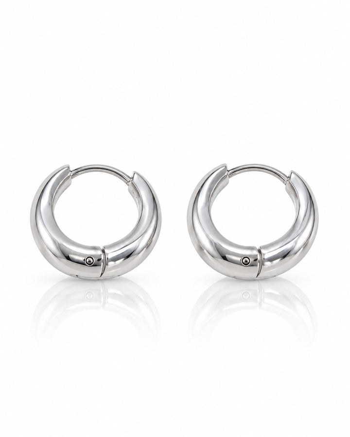 Elli Jewellery rhodium plated minimalist huggie hoop earrings with a polished silver finish and secure hinged clasp.