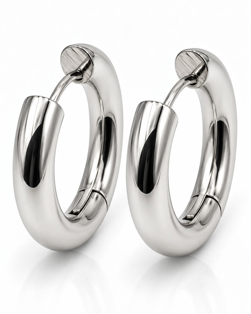 Elli Jewellery rhodium plated waterproof huggie hoop earrings with a polished silver-toned finish and hinged closure.