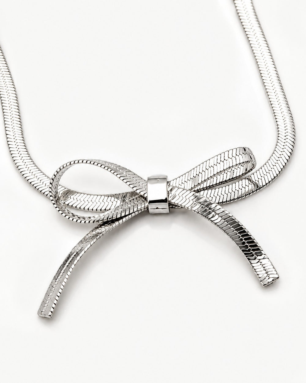 Elli Jewellery rhodium plated silver-tone snake chain necklace featuring a sculptural bow knot design