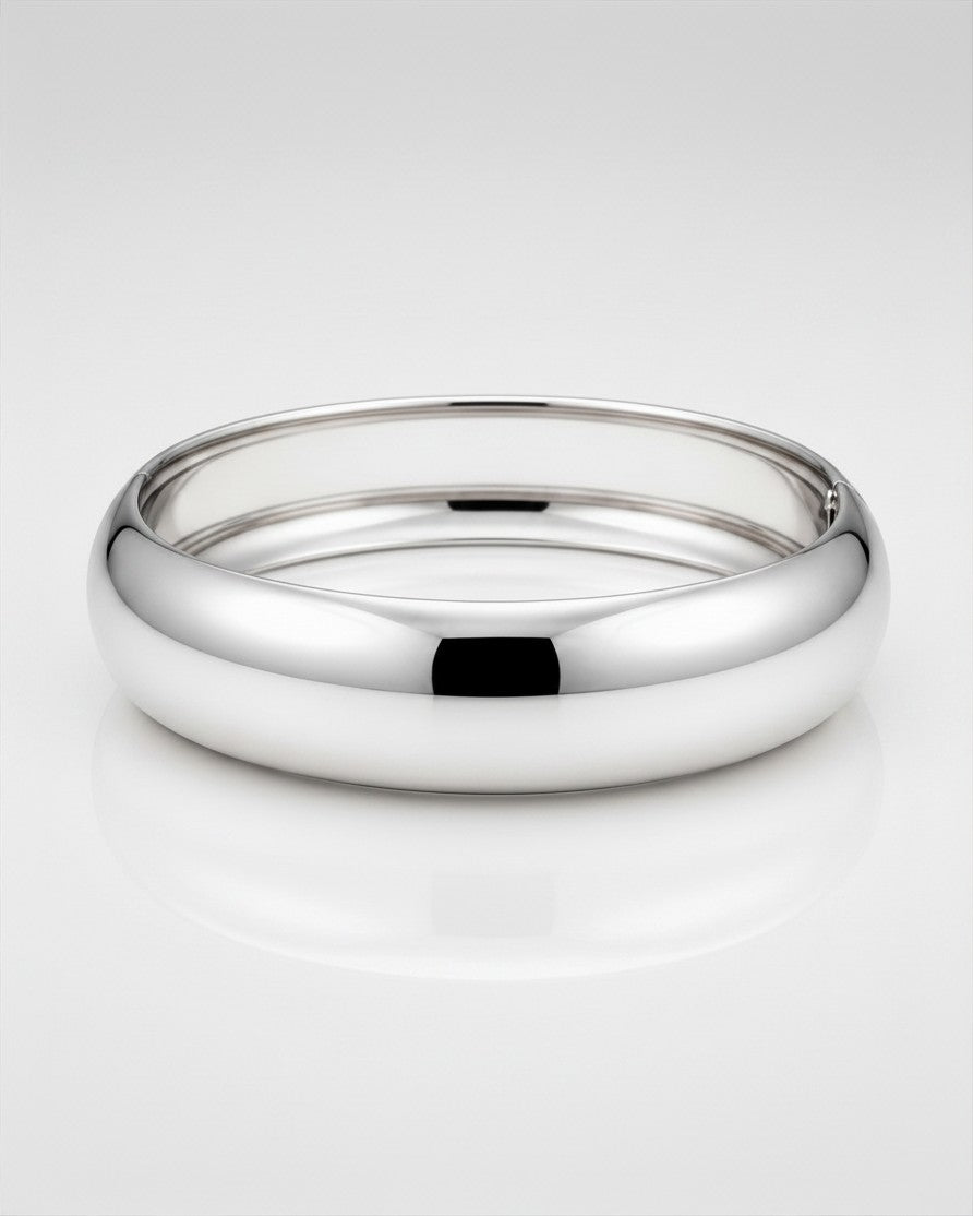 Elli Jewellery rhodium plated 2cm wide polished bangle bracelet with a sleek, tarnish-free, and waterproof design.