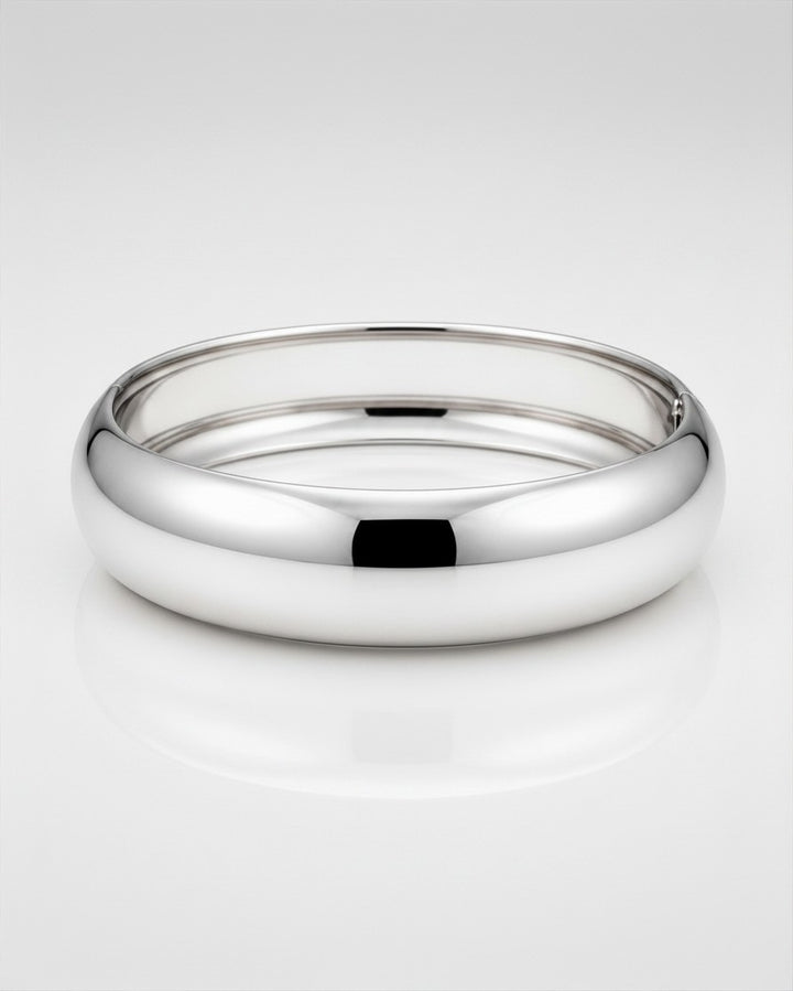 Elli Jewellery rhodium plated 2cm wide polished bangle bracelet with a sleek, tarnish-free, and waterproof design.