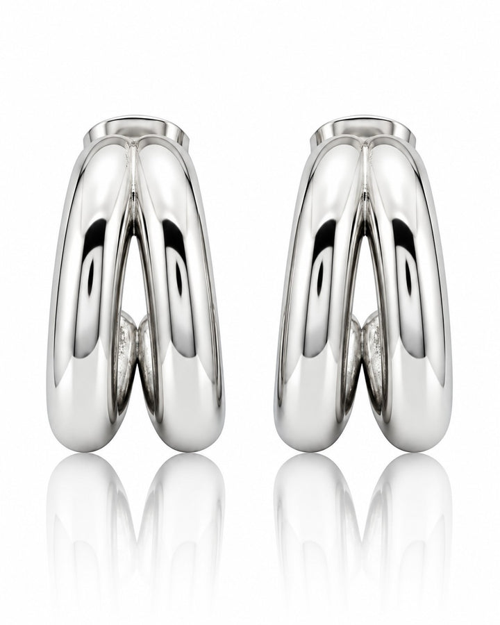 Elli Jewellery rhodium plated hollow C-shaped hoop earrings with a polished silver-tone finish on a white background