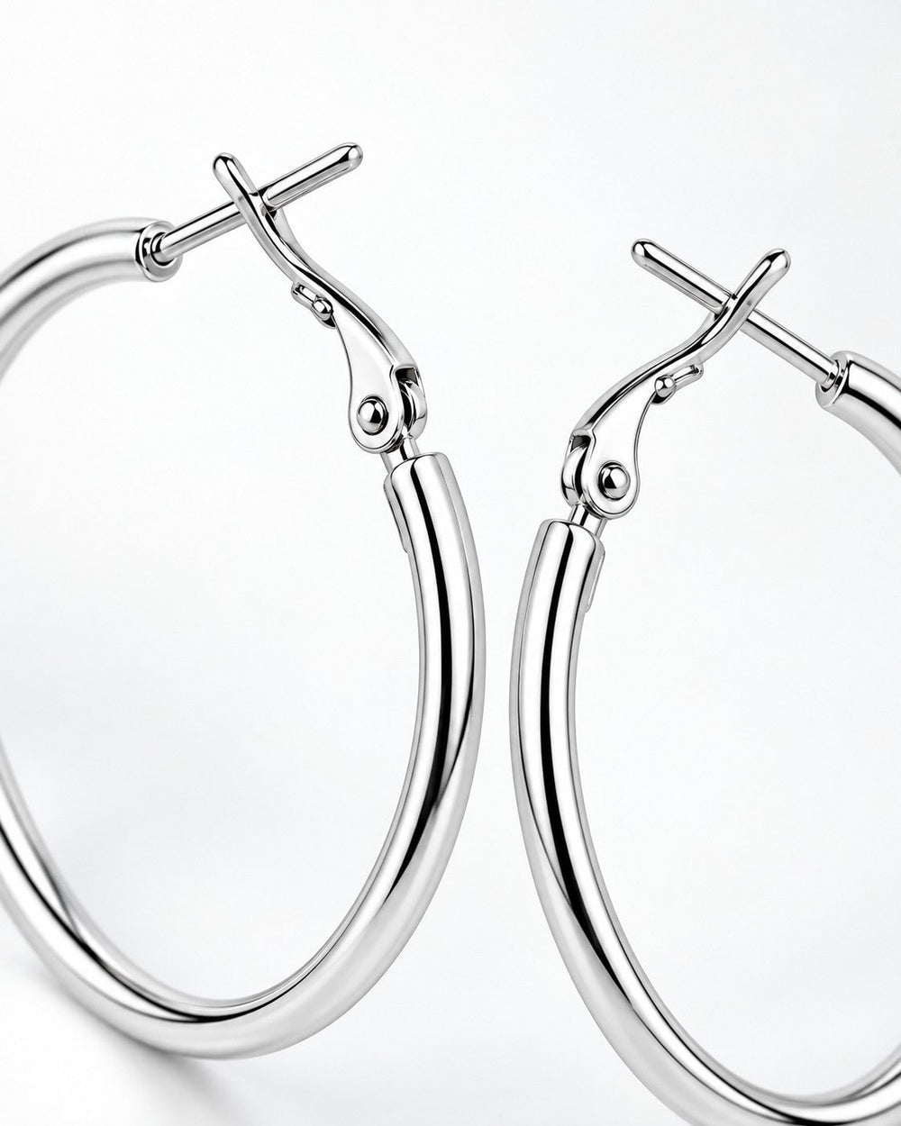 Elli Jewellery classic smooth rhodium plated hoop earrings with a polished silver finish on a white background