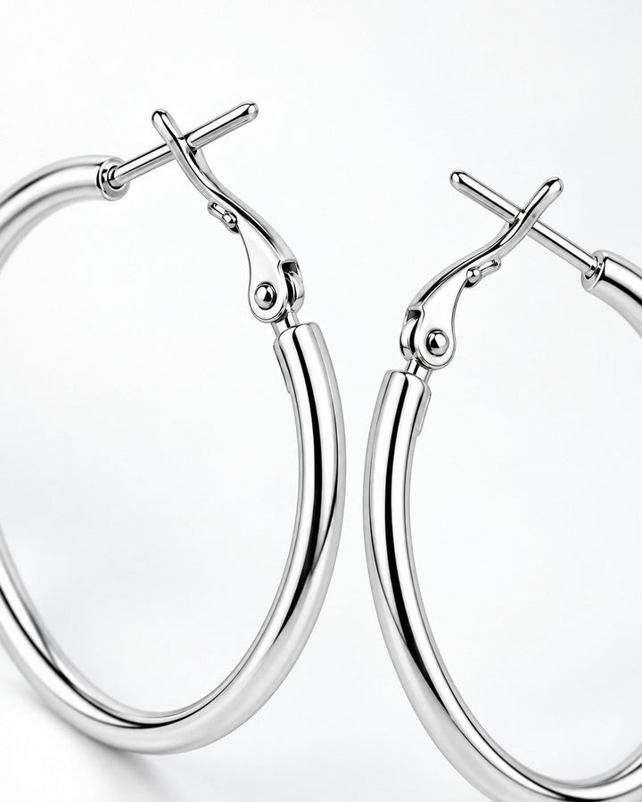 Elli Jewellery classic smooth rhodium plated hoop earrings with a polished silver finish on a white background