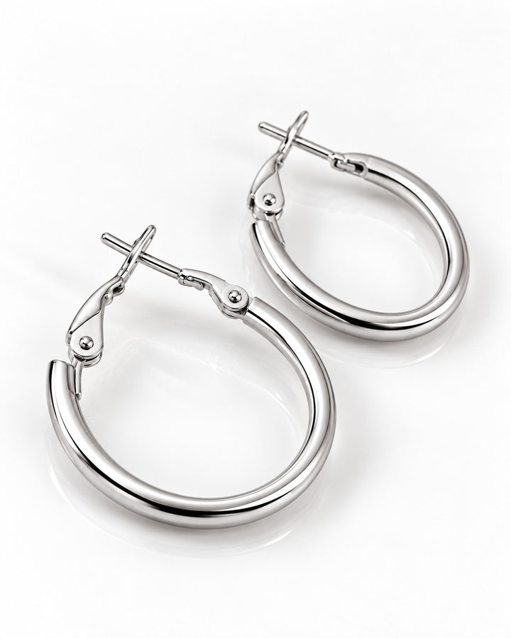 Elli Jewellery rhodium plated hoop earrings with a polished silver finish and secure hinged clasp on white background