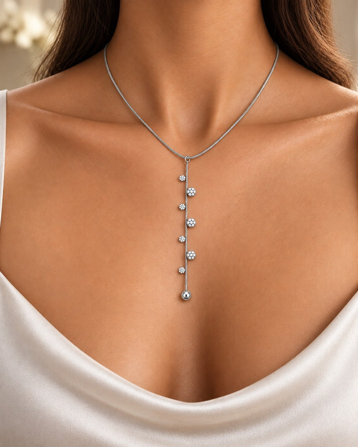 Elli Jewellery rhodium plated minimalist lariat necklace with delicate chain and sparkling stone accents on a model