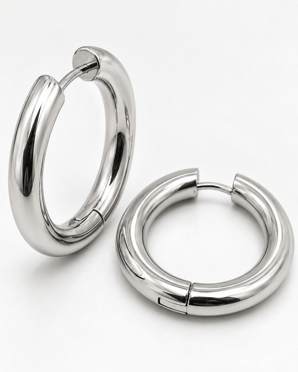 Elli Jewellery rhodium plated mid hoop earrings with a polished silver finish and a sleek, waterproof design.