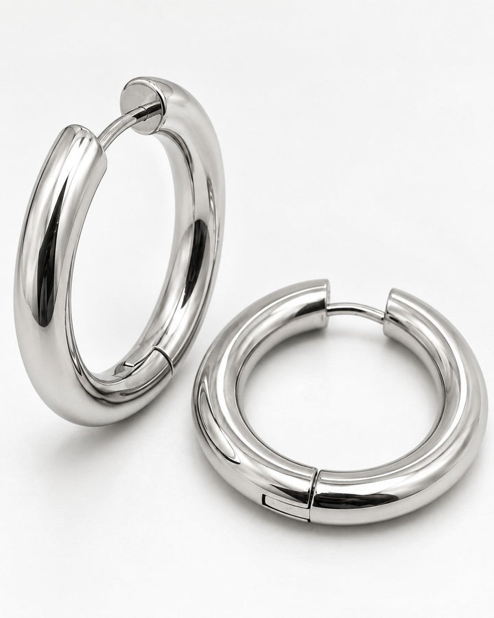 Elli Jewellery rhodium plated mid hoop earrings with a polished silver finish and a sleek, waterproof design.
