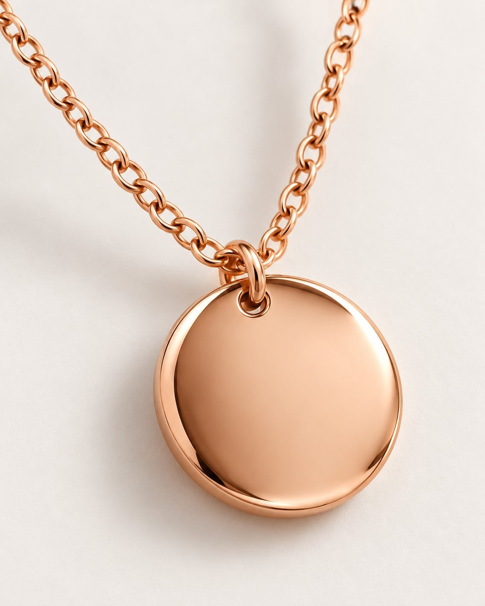 Elli Jewellery minimalist rose gold plated pendant necklace on a delicate chain with a polished round coin design