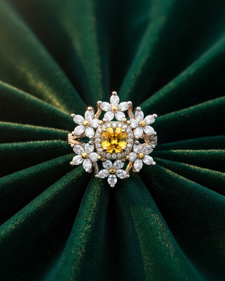 Elli Jewellery silver plated floral statement ring featuring a vibrant yellow cubic zirconia stone and clear petals.