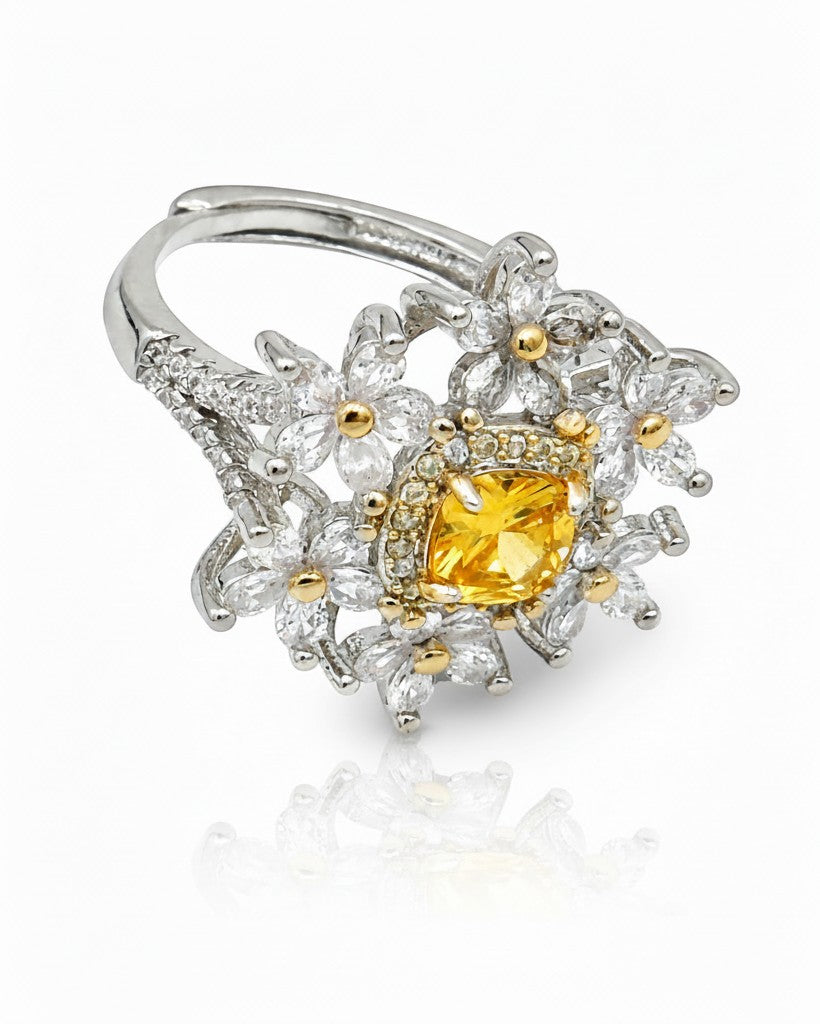 Elli Jewellery silver plated statement ring featuring a vibrant yellow cubic zirconia stone and floral petal design.
