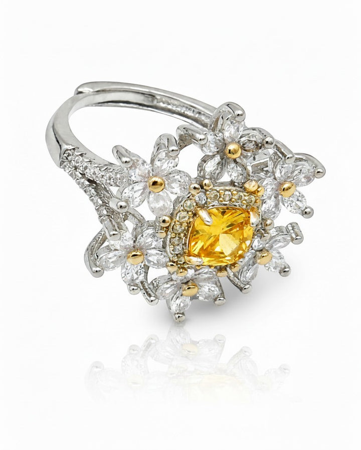Elli Jewellery silver plated statement ring featuring a vibrant yellow cubic zirconia stone and floral petal design.