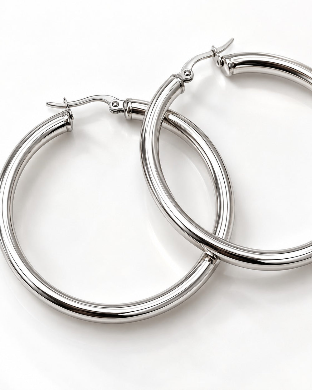 Elli Jewellery 40mm silver hoop earrings with a polished finish and secure hinged clasp on a white background