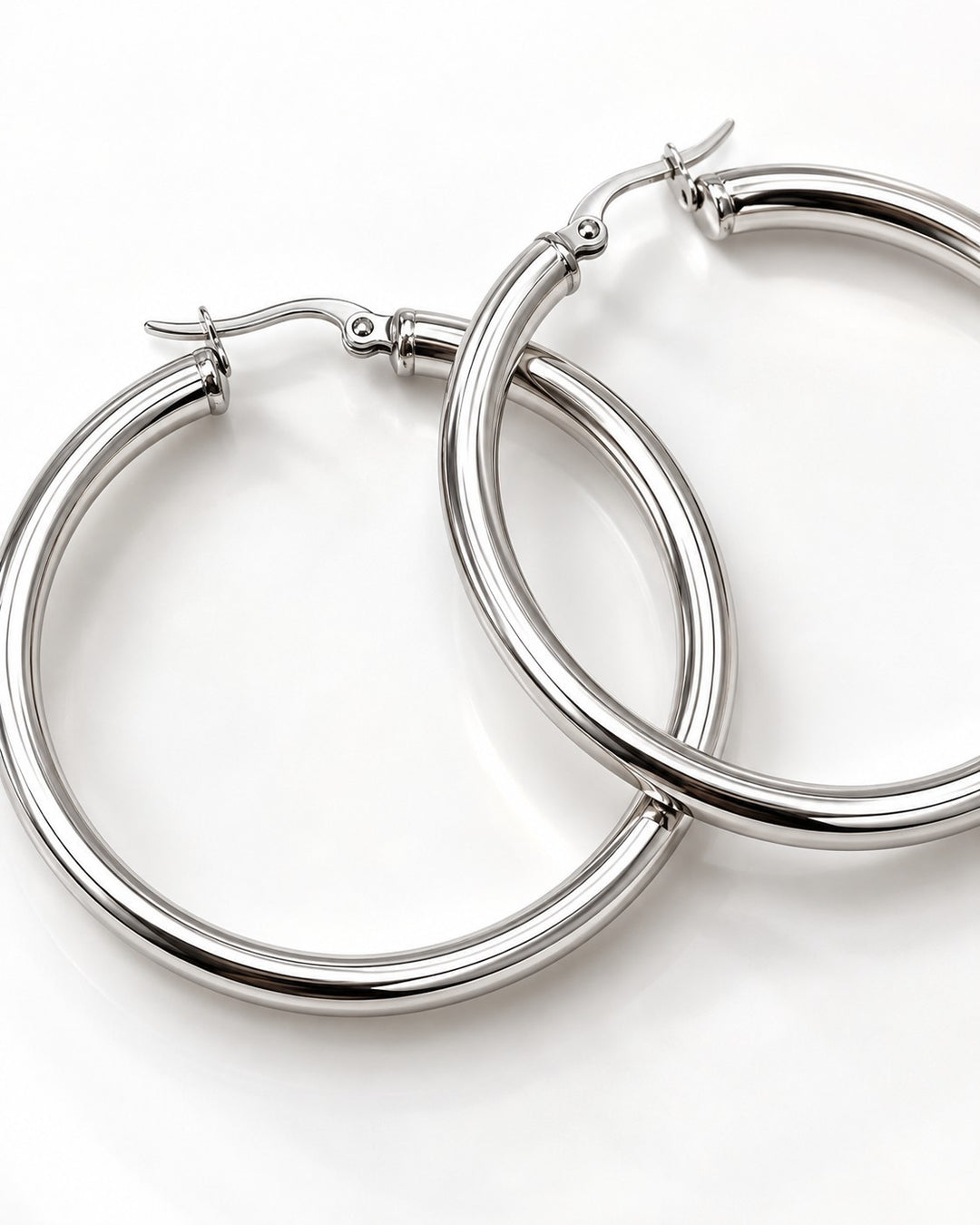 Elli Jewellery 40mm silver hoop earrings with a polished finish and secure hinged clasp on a white background