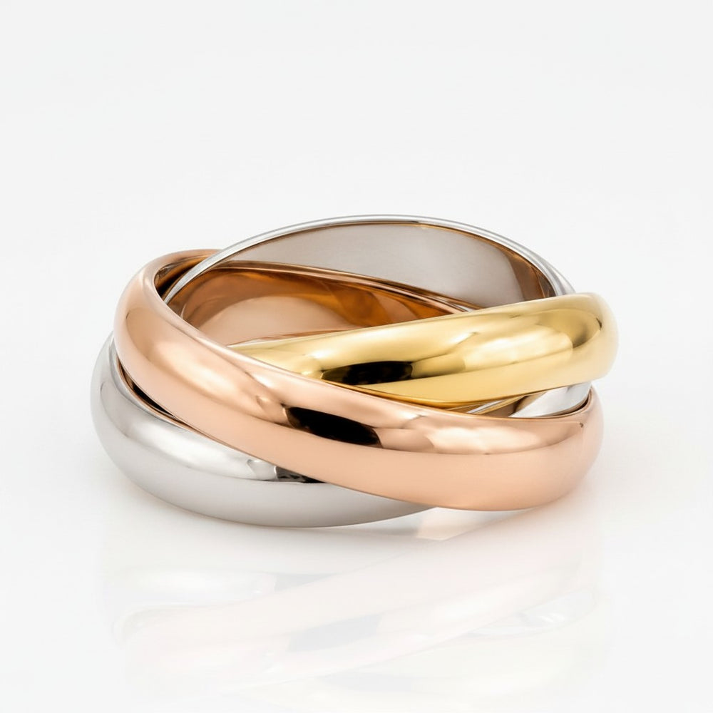 Elli Jewellery Trinity rolling ring featuring three interlocking bands in gold, rose gold, and rhodium plated finishes.