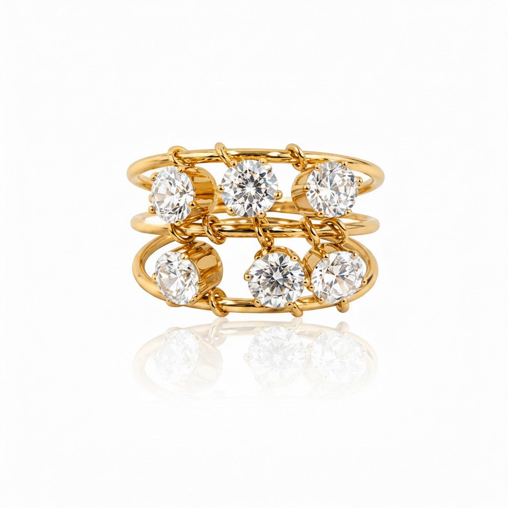 Elli Jewellery triple band statement ring in 18ct gold plated brass with six clear round cubic zirconia stones.
