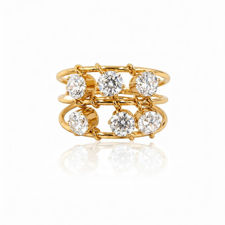 Elli Jewellery triple band statement ring in 18ct gold plated brass with six clear round cubic zirconia stones.