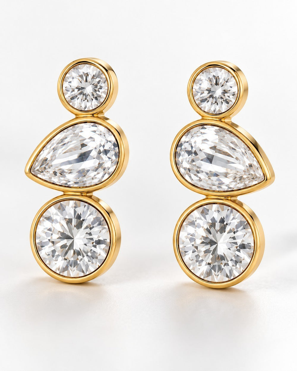 Elli Jewellery triple crystal drop earrings featuring bezel-set cubic zirconia in 18ct gold plated metal