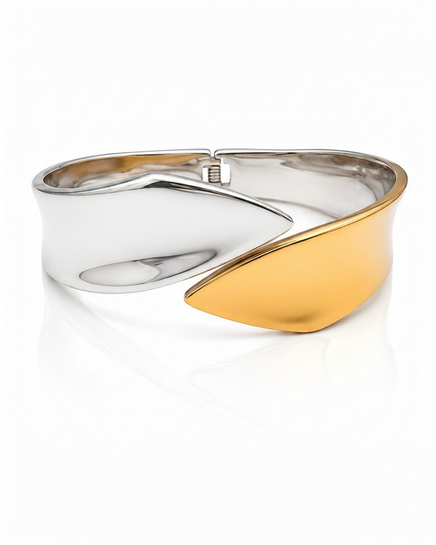 Elli Jewellery two-tone bangle bracelet featuring a sculptural fusion of polished silver and matte rose gold metal.