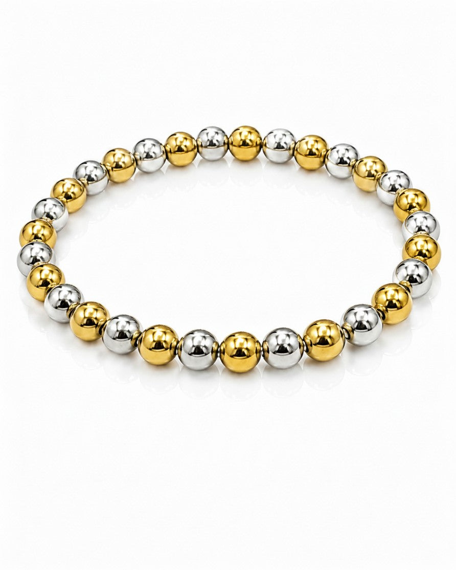 Elli Jewellery two-tone stretch bracelet with alternating gold and silver plated beads on a white background.