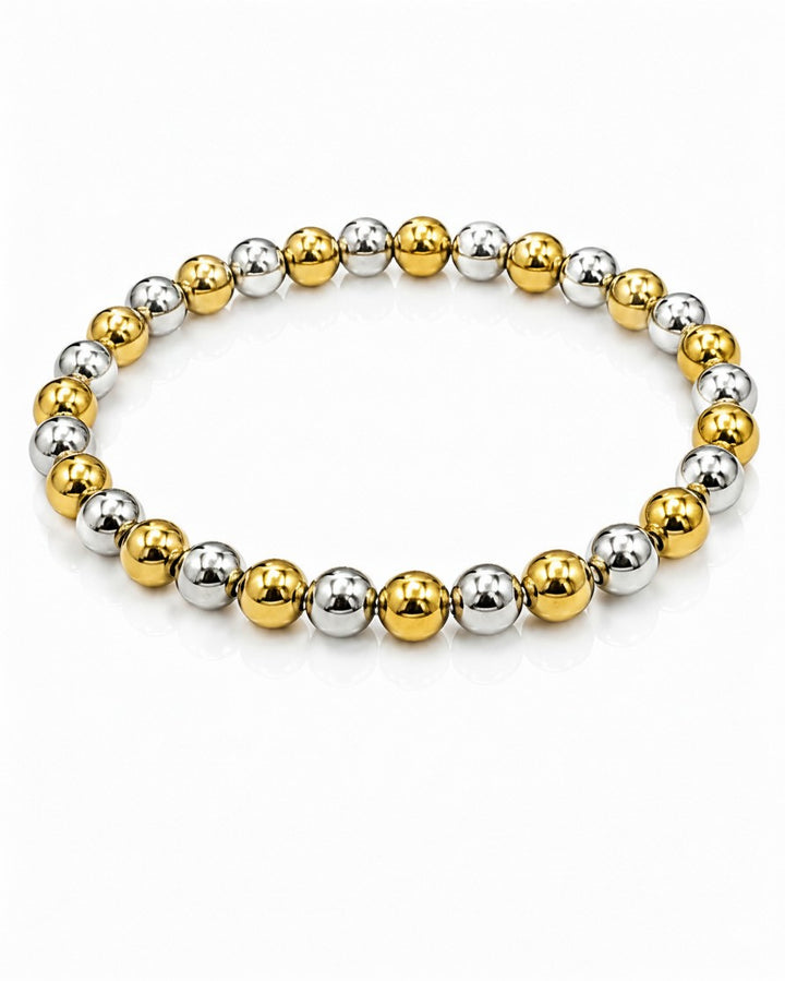 Elli Jewellery two-tone stretch bracelet with alternating gold and silver plated beads on a white background.