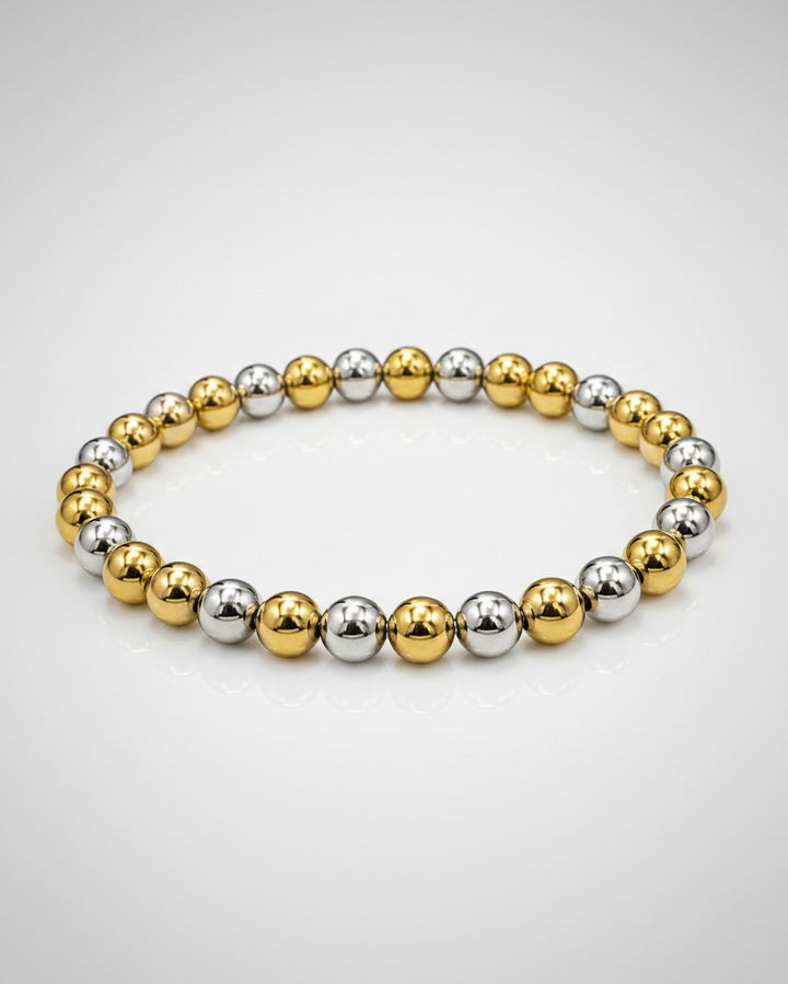Elli Jewellery two-tone stretch bracelet featuring alternating gold and silver plated beads on a white background.