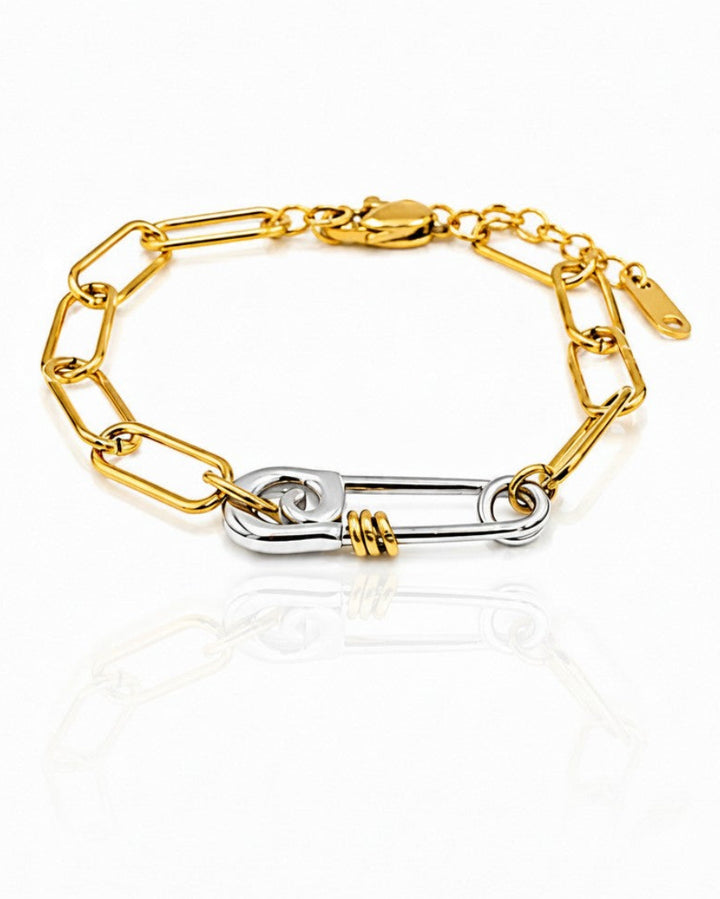 Elli Jewellery two-tone gold and silver chain link bracelet featuring a unique safety pin clasp design.