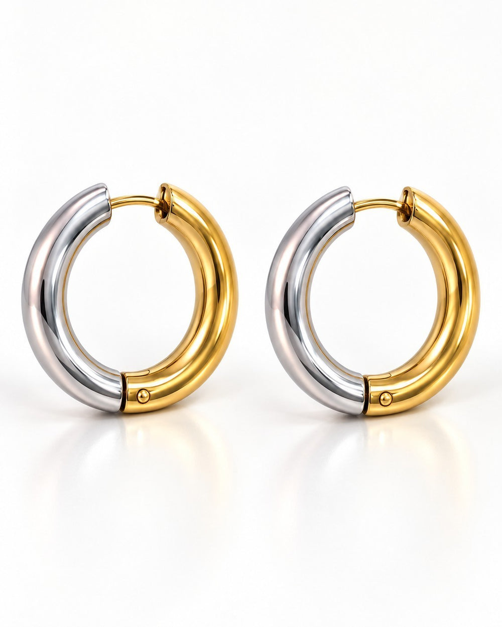 Elli Jewellery two-tone chunky huggie hoop earrings featuring a polished gold and silver plated finish.