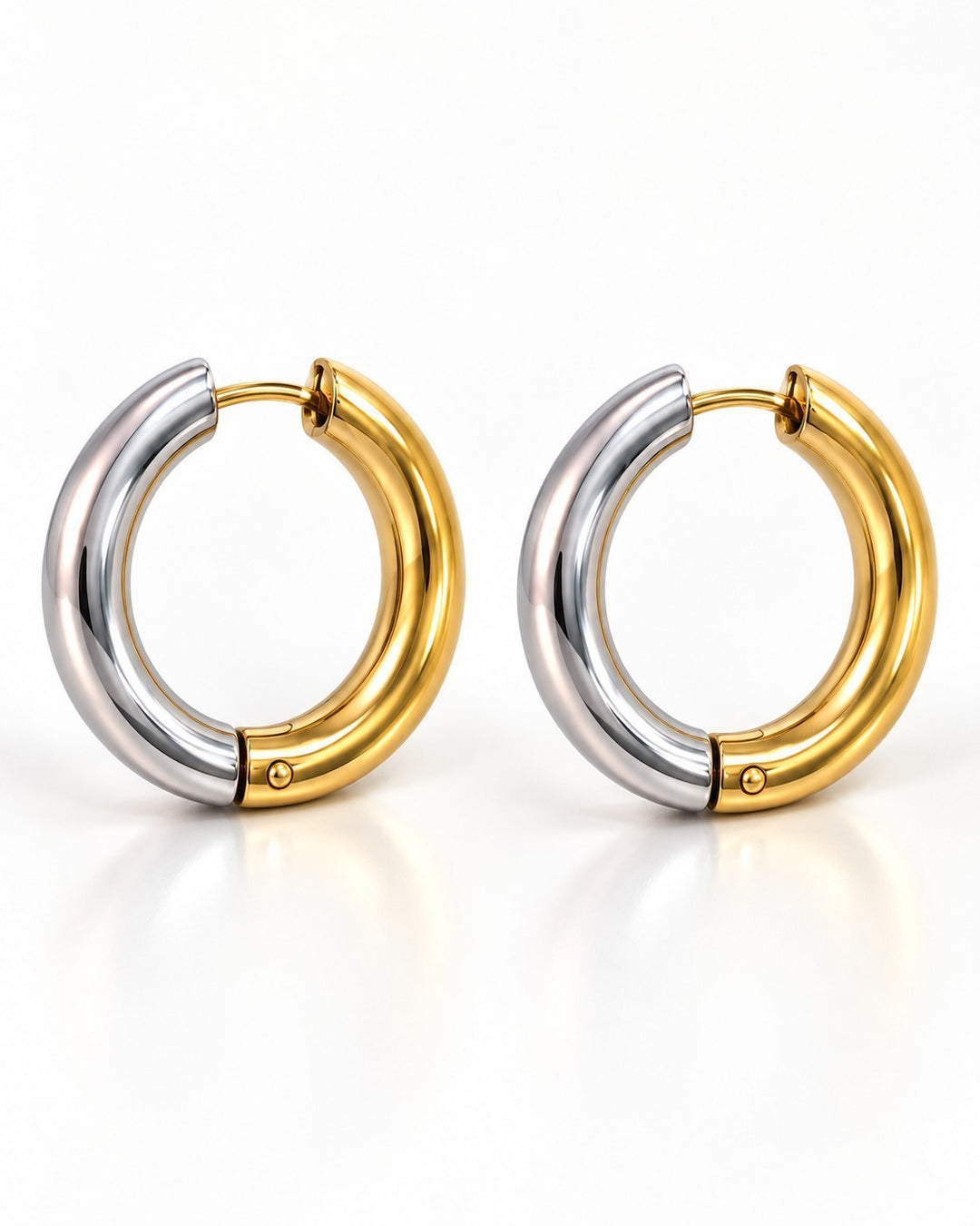 Elli Jewellery two-tone chunky huggie hoop earrings featuring a polished gold and silver plated finish.