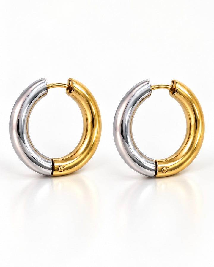 Elli Jewellery two-tone chunky huggie hoop earrings featuring a polished gold and silver plated finish.