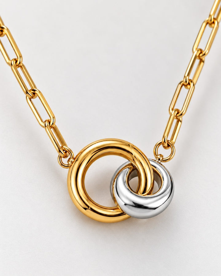 Elli Jewellery two-tone geometric link chain necklace featuring interlocking gold and silver-tone circular pendants.