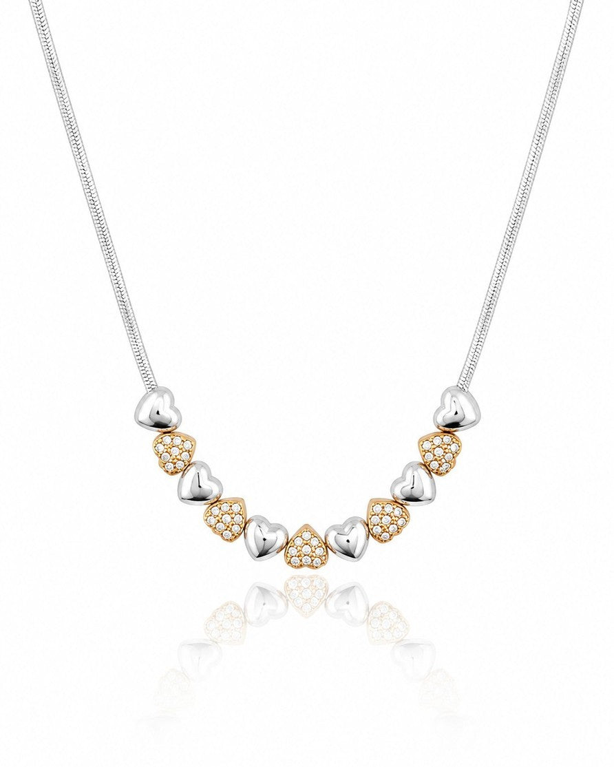 Elli Jewellery two-tone necklace featuring alternating rhodium-plated silver and crystal-set gold-plated heart charms.