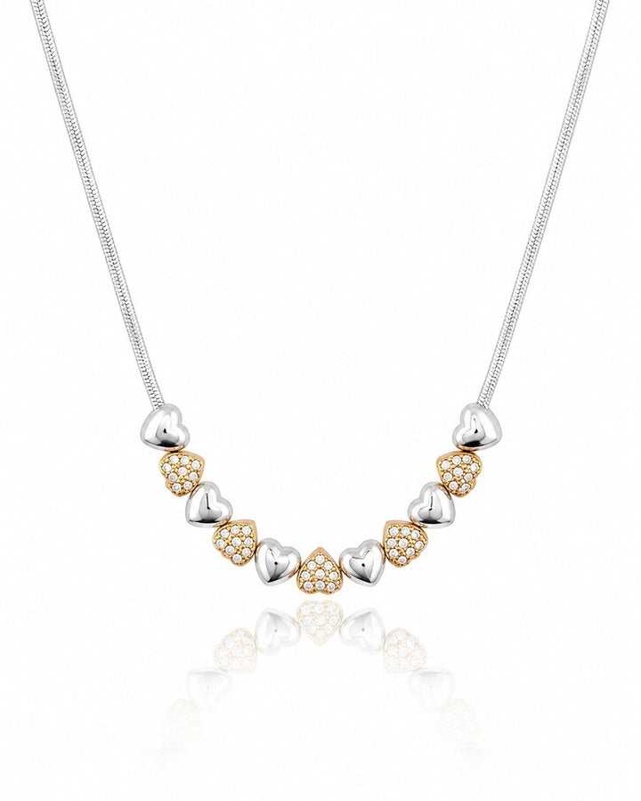 Elli Jewellery two-tone necklace featuring alternating rhodium-plated silver and crystal-set gold-plated heart charms.