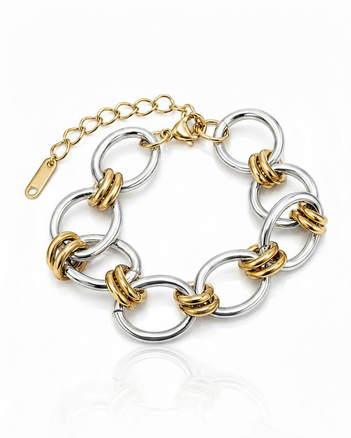 Elli Jewellery two-tone ribbed link statement bracelet in gold and silver plated metal on a white background.