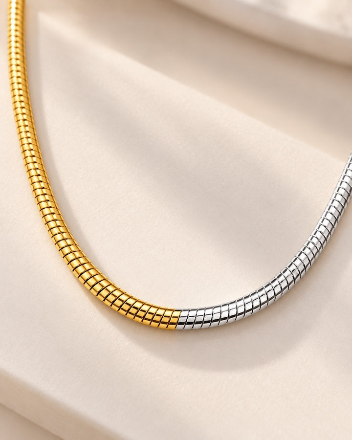 Elli Jewellery two-tone snake chain necklace featuring a sleek gold and silver plated waterproof design.