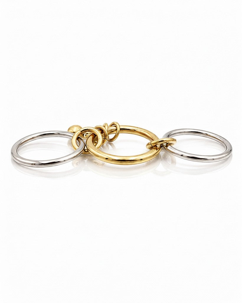 Elli Jewellery two-tone stacked ring set featuring three layered gold and silver bands on a white background.