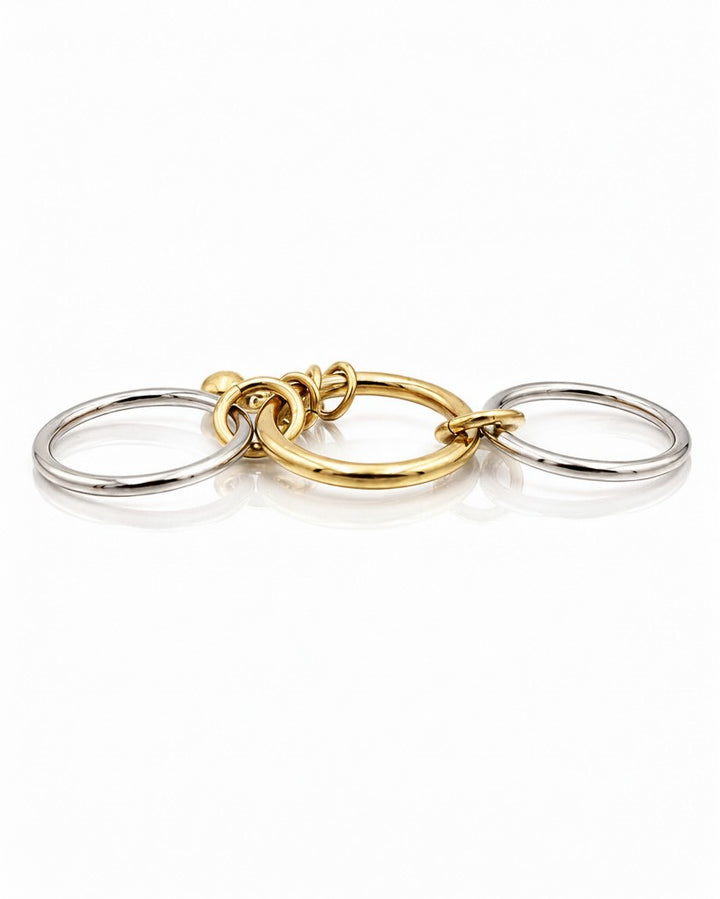 Elli Jewellery two-tone stacked ring set featuring three layered gold and silver bands on a white background.
