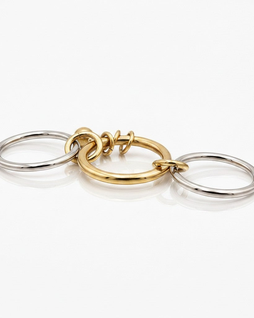 Elli Jewellery two-tone stacked ring set featuring three interlocking gold-plated and silver-toned bands.