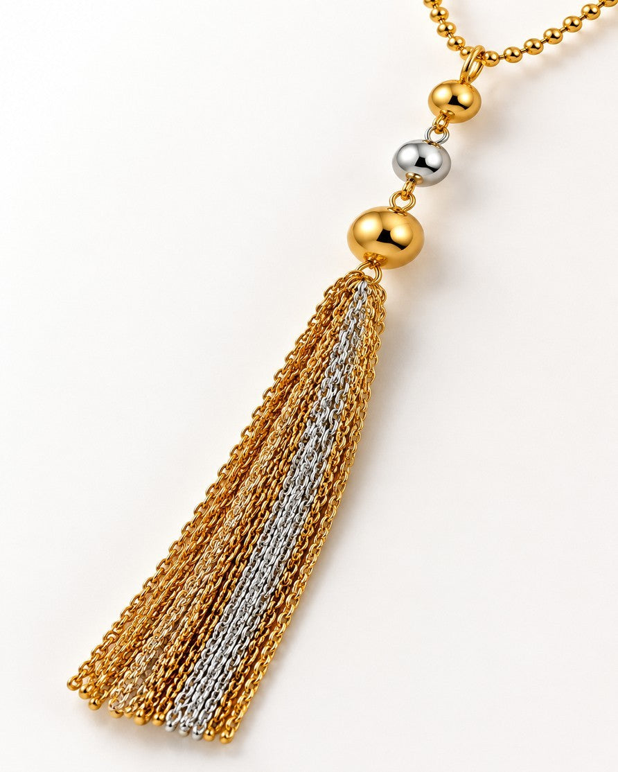 Elli Jewellery two-tone layered tassel necklace featuring gold and silver chains with polished metallic beads.