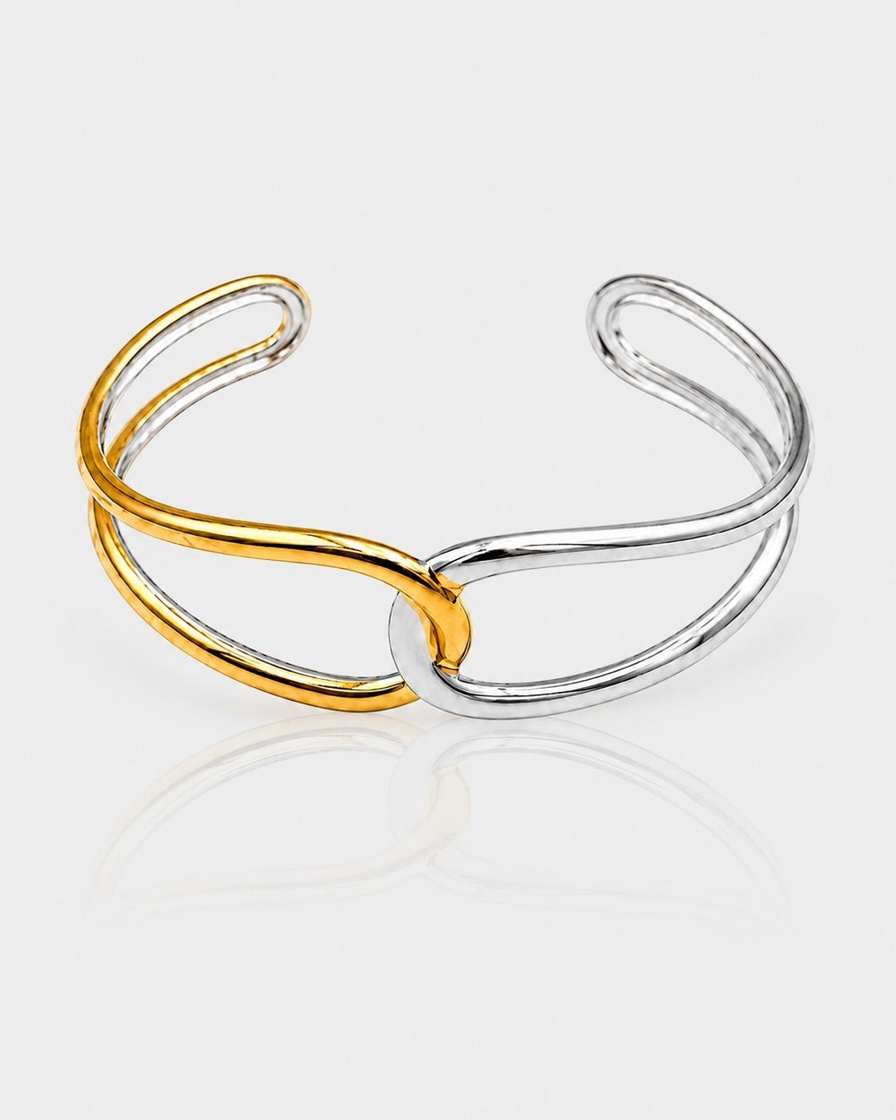 Elli Jewellery two-tone twist bangle bracelet in gold and silver plating with an intertwined open cuff design.