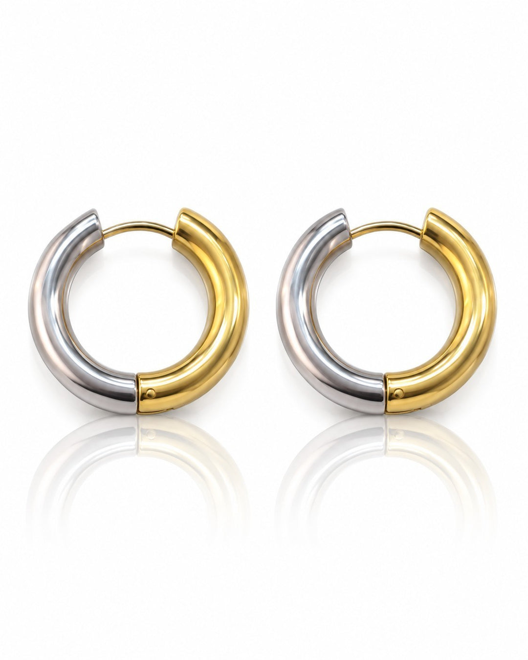 Elli Jewellery two-toned 24mm chunky huggie hoop earrings featuring a polished gold and silver plated finish.