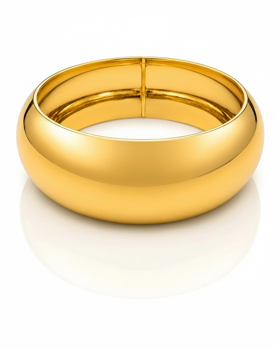 Elli Jewellery wide gold plated statement bangle bracelet with a polished waterproof finish.