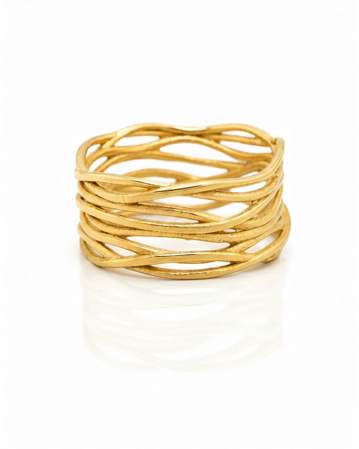 Elli Jewellery wide gold plated band ring featuring an intricate woven reed texture pattern on a white background.
