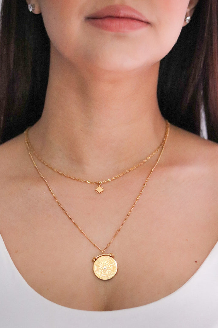 Gold Toned Double Layered Necklace with Sun and Sundial